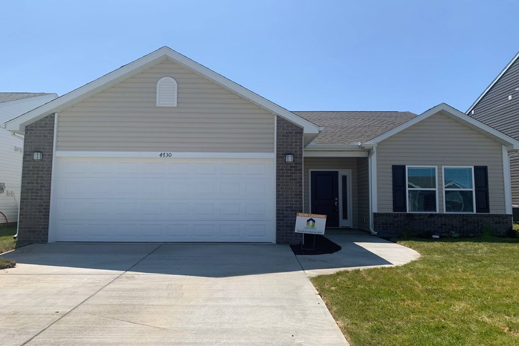 a house with a white garage door